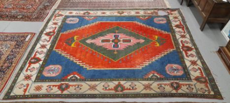 A TURKISH CARPET OF TRIBAL DESIGN 369 x 300 cm