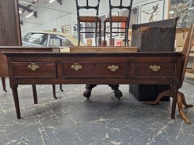 A 19th C. OAK THREE DRAWER DRESSER ON TAPERING CYLINDRICAL FRONT LEGS. W 172 x D 49 x H 70cms.