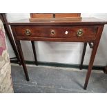 AN EARLY 19th C. MAHOGANY SIDE TABLE WITH A SINGLE DRAWER AND ON TAPERING SQUARE LEGS. W 77 x D 34.5