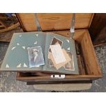 A STAINED PINE BOX WITH SILVERED IRON HANDLES AND CONTAINING LATE VICTORIAN PHOTOGRAPH ALBUMS AND