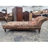 A VICTORIAN ARTS AND CRAFTS PERIOD OAK FRAMED DAY BED WITH KELIM UPHOLSTERY.