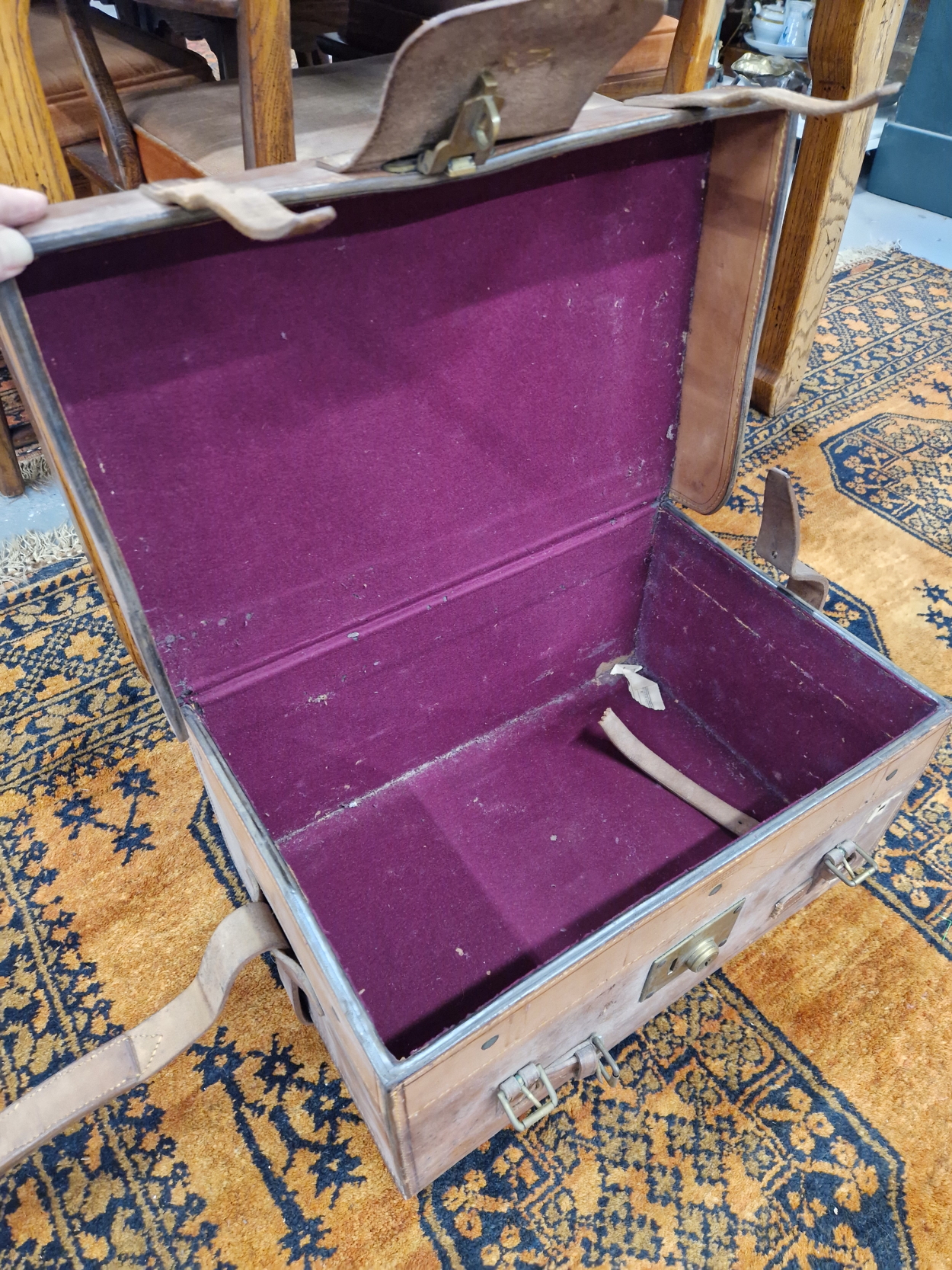 A LEATHER SUITCASE LINED WITH PURPLE BAIZE AND SECURED BY THREE LEATHER STRAPS, THE LID. 51 x - Image 2 of 2