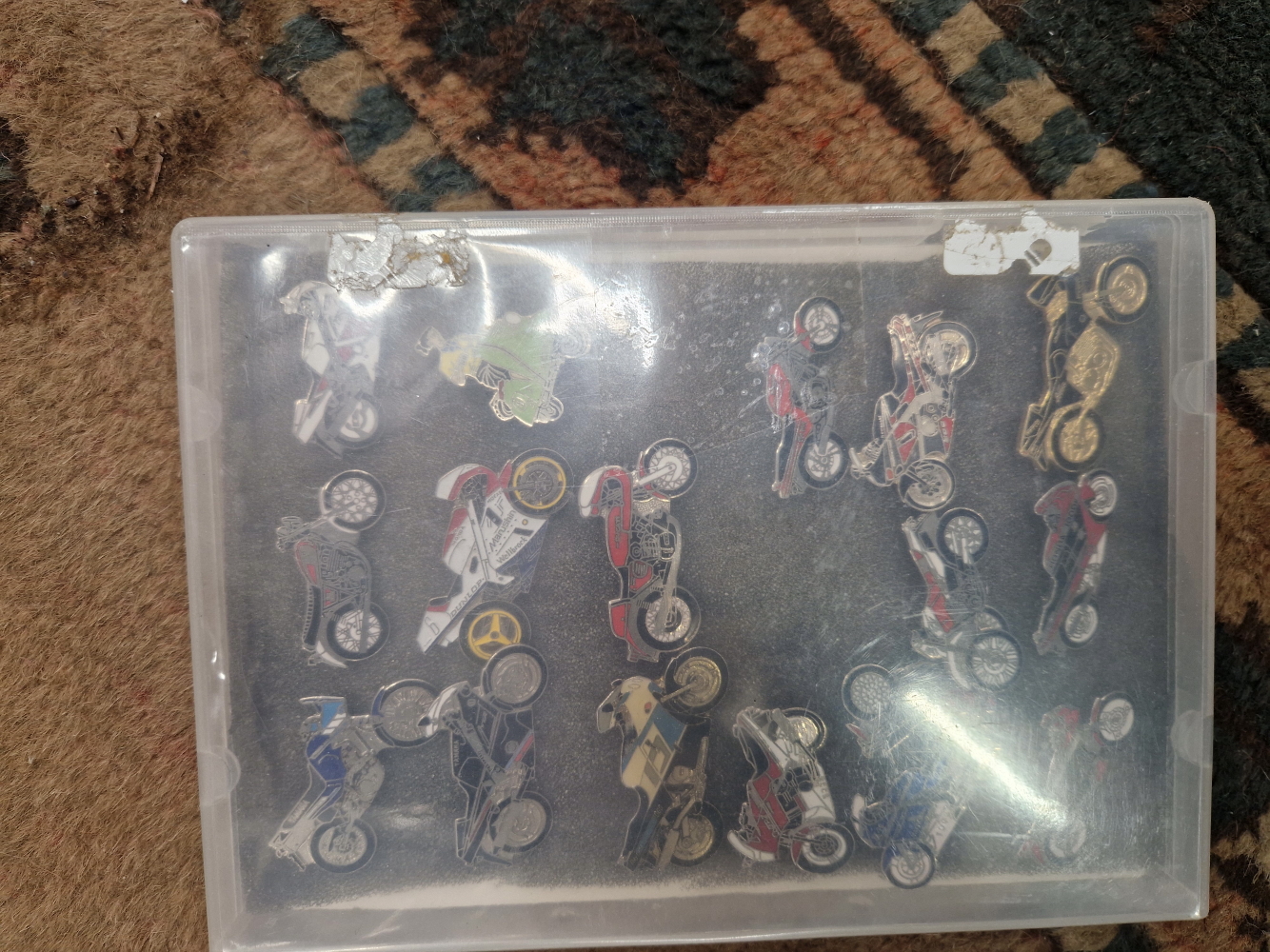 A SMALL COLLECTION OF MOTORCYCLE PIN BADGES.