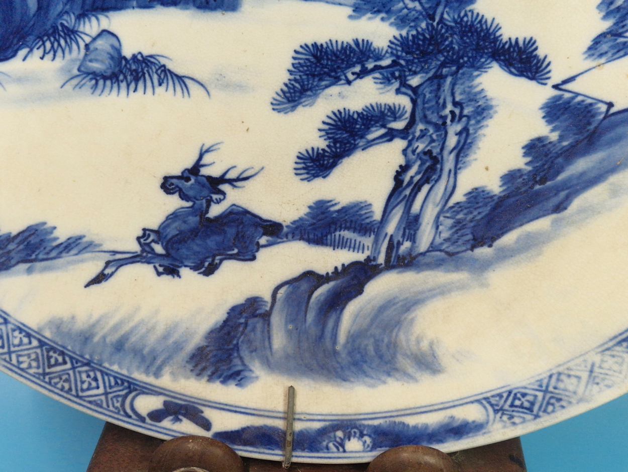 A PAIR OF CHINESE BLUE AND WHITE CHARGERS PAINTED WITH MOUNTAINOUS ISLANDS, A BUFFALO ON ONE AND A - Image 2 of 14