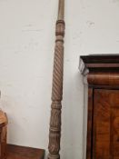 A PAIR OF MAHOGANY FOUR POSTER BED POSTS SPIRALLY TURNED BETWEEN LEAF BANDS