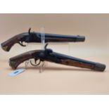 A PAIR OF SWEDISH PERCUSSION CAP PISTOLS WITH BRASS MOUNTED BUTTS, TRIGGER GUARDS AND MUZZLES
