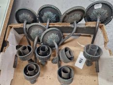 A SET OF SIX DARKLY PATINATED BRONZE WALL LIGHTS, AS RETAILED BY CHARLES EDWARDS, EACH WITH A SINGLE