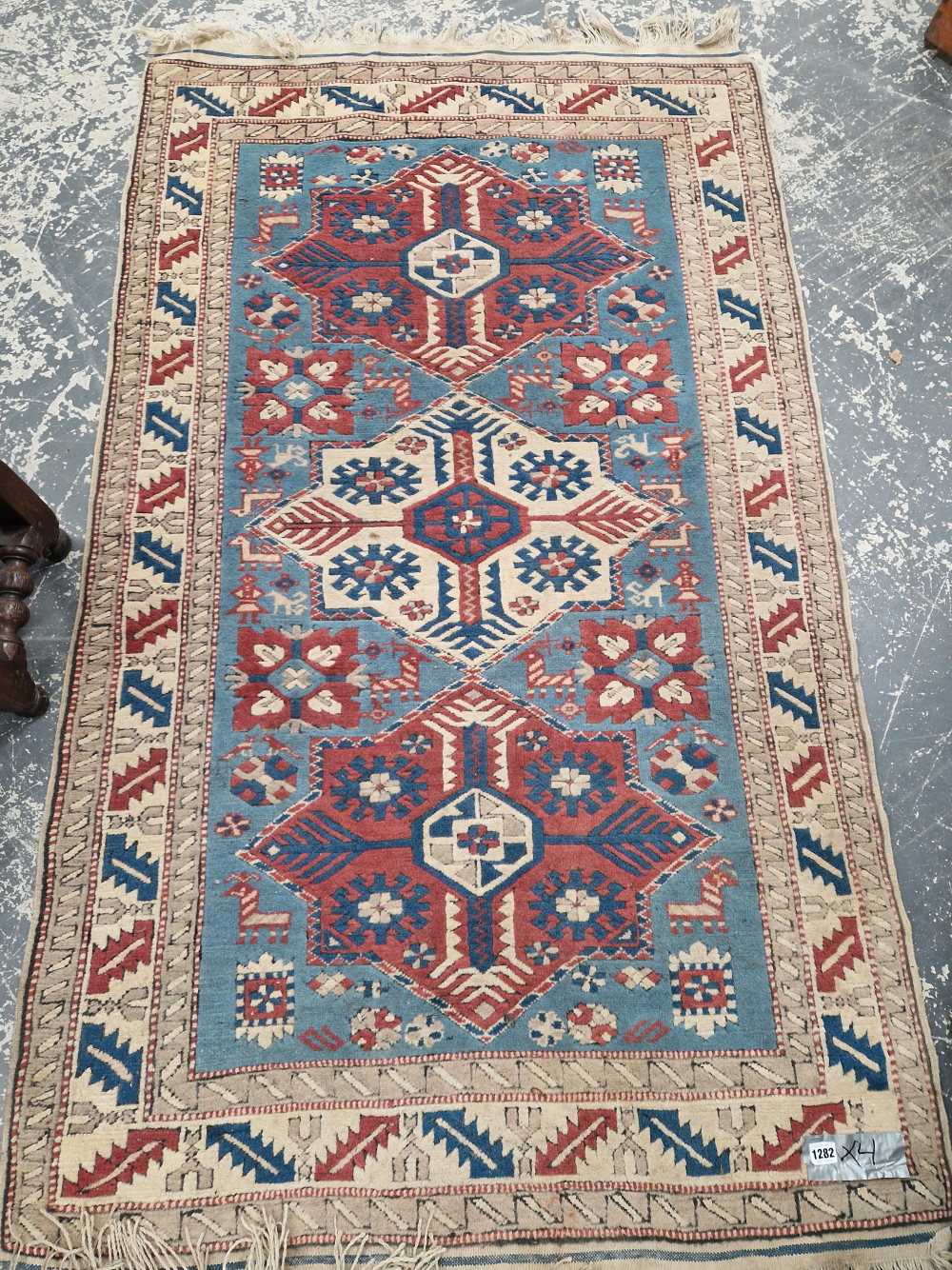 A TURKISH RUG OF CAUCASIAN DESIGN 186 x 109cm, TOGETHER WITH TWO ANTIQUE PERSIAN RUGS AND AN - Image 3 of 4