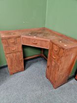 AN ART DECO WALNUT CORNER DRESSING TABLE AND STOOL TOGETHER WITH A TALLBOY CABINET