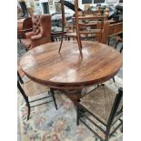 A 19th C. ROSEWOOD BREAKFAST TABLE ON AN OCTAGONAL COLUMN TRIPARTITE PLINTH AND SCROLL FEET. Dia.