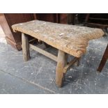 A RUSTIC OAK STOOL