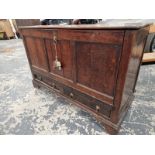 AN 18th C. OAK MULE CHEST LATER CONVERTED WITH A PULL DOWN THREE PANELLED FRONT OVER TWO DRAWERS,