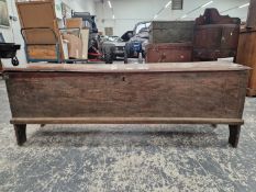 A 17TH CENTURY ELM PLANK COFFER WITH SHALLOW CARVED DECORATION TO FRONT PANEL.