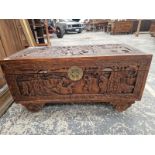 A SMALL ORIENTAL CARVED CAMPHORWOOD BLANKET CHEST