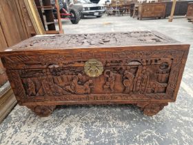 A SMALL ORIENTAL CARVED CAMPHORWOOD BLANKET CHEST