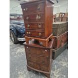 TWO 20th C. MAHOGANY CHESTS, ONE FLAT FRONTED WITH FOUR DRAWERS, THE OTHER BOW FRONTED AND WITH