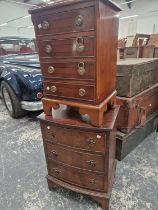TWO 20th C. MAHOGANY CHESTS, ONE FLAT FRONTED WITH FOUR DRAWERS, THE OTHER BOW FRONTED AND WITH