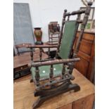 AN ANTIQUE AMERICAN CHILDS ROCKING CHAIR.