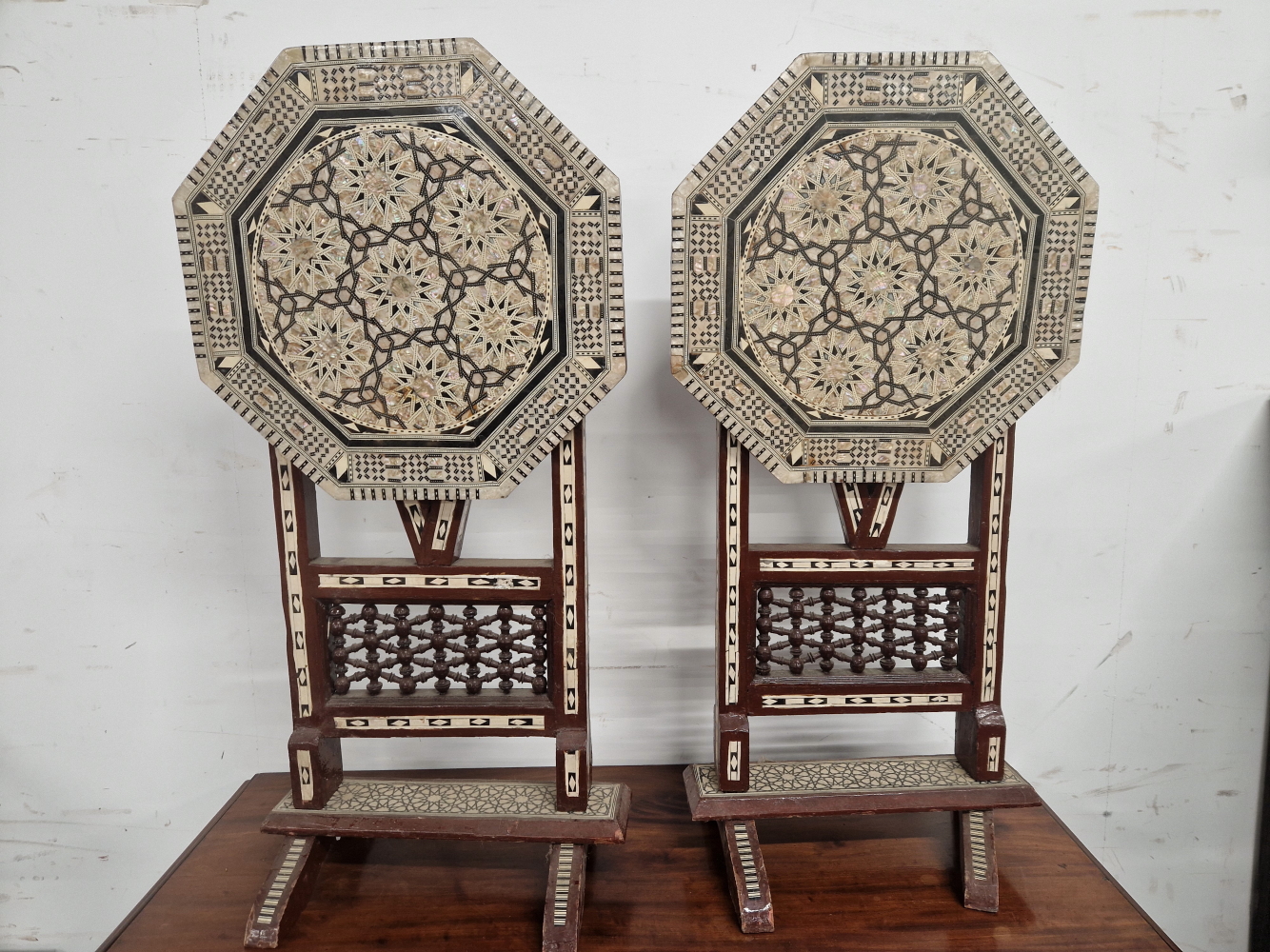A PAIR OF ISLAMIC FOLDING OCTAGONAL TABLES GEOMETRICALLY INLAID IN MOTHER OF PEARL AND EBONY - Image 6 of 13