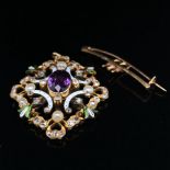 AN ANTIQUE SUFFRAGETTE PENDANT / BROOCH IN A FITTED CASE. THE PENDANT SET WITH AN OVAL CUT CENTRAL