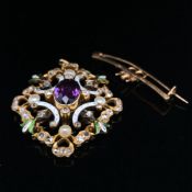 AN ANTIQUE SUFFRAGETTE PENDANT / BROOCH IN A FITTED CASE. THE PENDANT SET WITH AN OVAL CUT CENTRAL