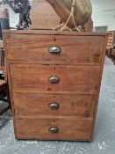 A W M NICHOLSON OF LEEDS TEAK CHEST OF FOUR DRAWERS WITH BRASS CUP HANDLES AND COMPARTMENTAL