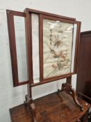 AN EBONY LINE INLAID MAHOGANY FIRE SCREEN WITH SLIDING GLASS PANELS AND A CHINESE PANEL