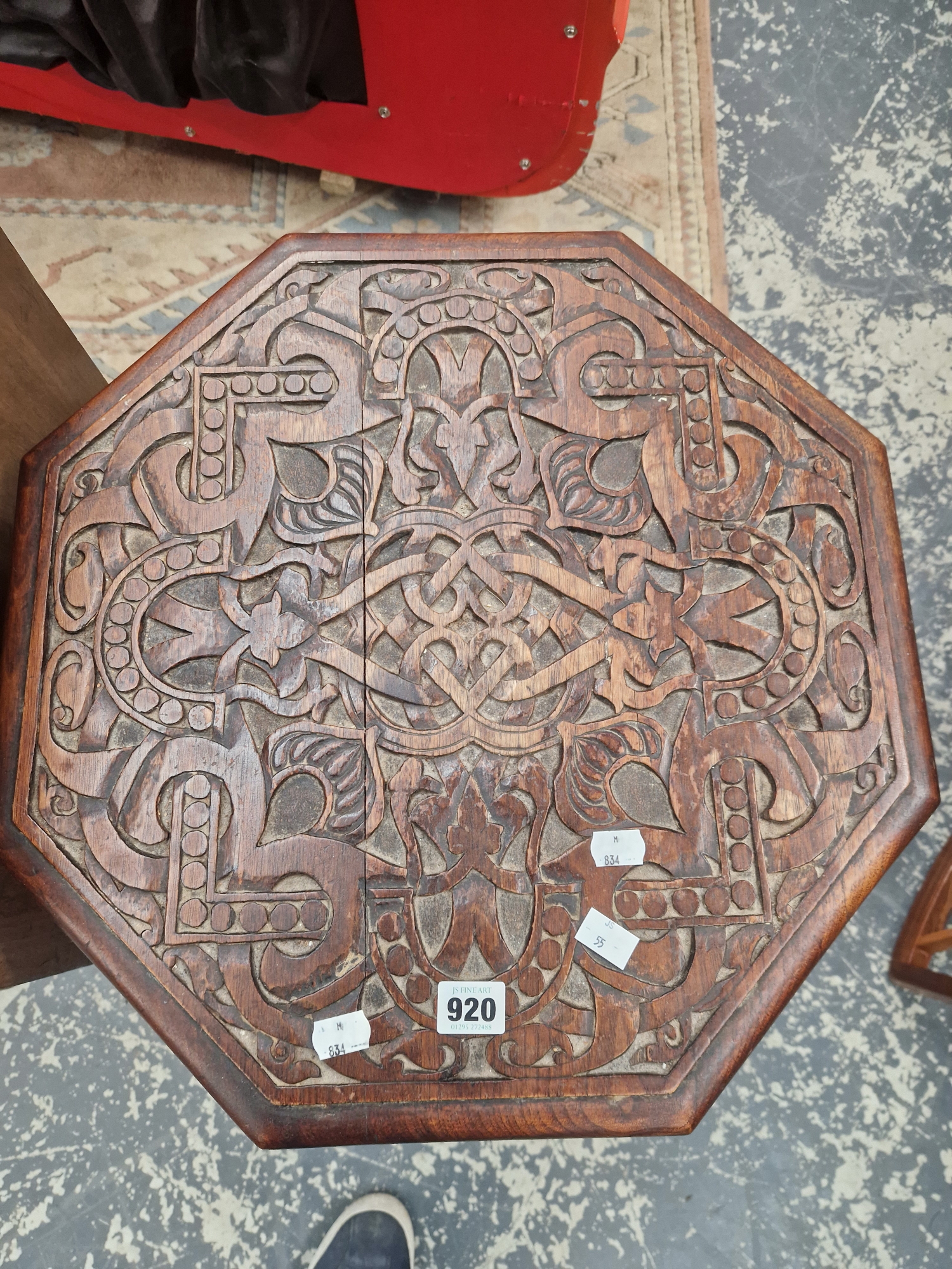 AN ISLAMIC MAHOGANY OCTAGONAL TABLE WITH A GEOMETRIC RELIEF CARVED TOP ABOVE EIGHT LEGS - Image 2 of 2