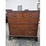 A 19TH CENTURY OAK CHEST OF 2 SHORT THREE LONG DRAWWERS ON SHAPED BRACKET FEET.