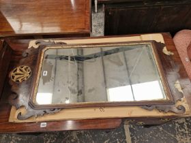 A GEORGE III MAHOGANY CUT WORK MIRROR CRESTED BY A PIERCED AND GILT ANTHEMION MOTIF. 110 x 58cms.