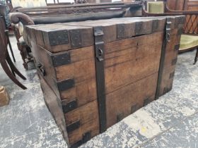 A VICTORIAN IRON BOUND OAK CHEST WITH HANDLES TO EACH NARROW END
