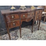 A MAHOGANY SERPENTINE FRONTED SIDEBOARD WITH A CONFIGURATION OF FIVE DRAWERS ABOVE SQUARE