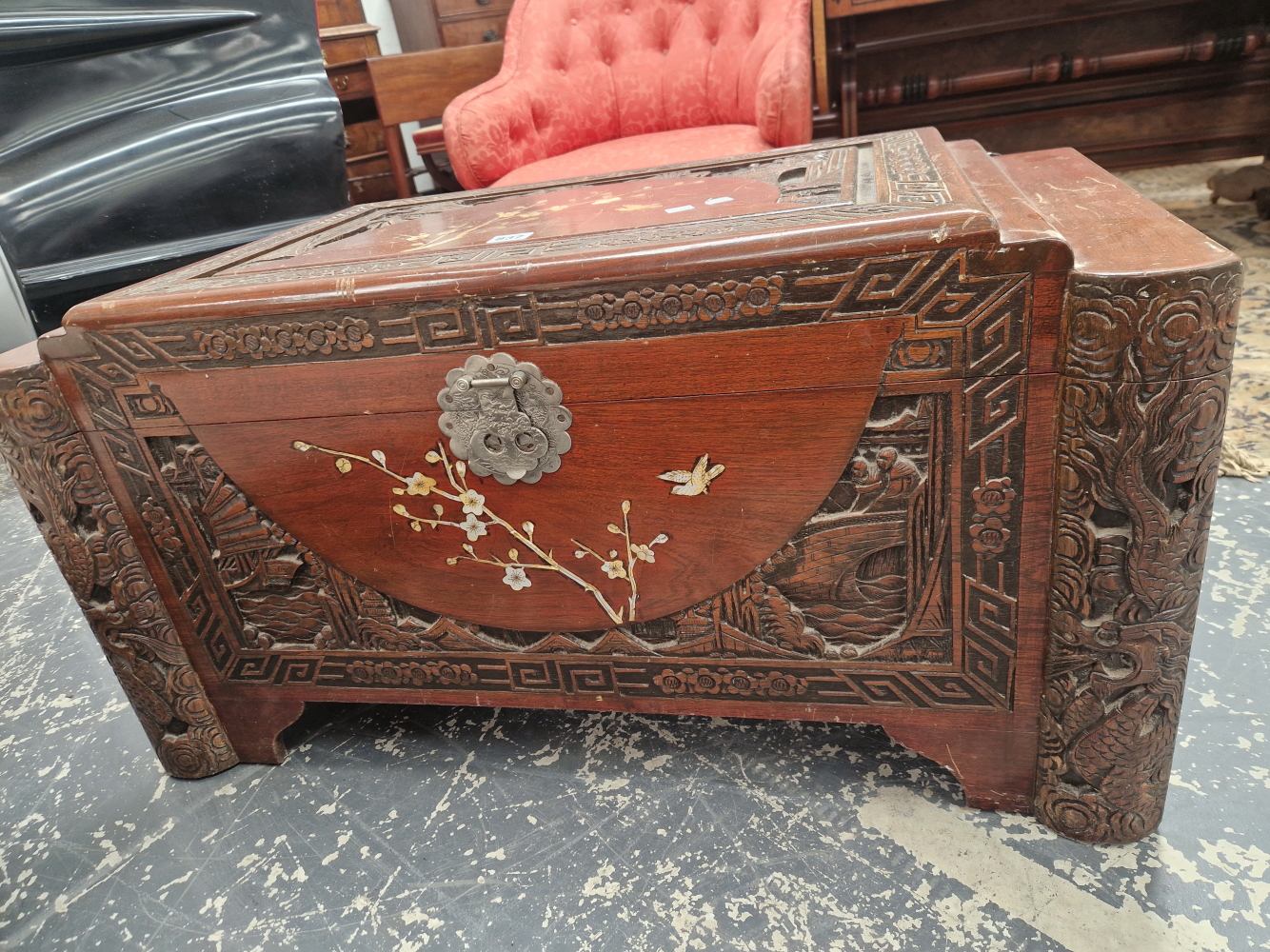 A CHINESE HARD WOOD COFFER, THE LID INLAID IN MOTHER OF PEARL WITH A SPRAY OF CHERRY BLOSSOM