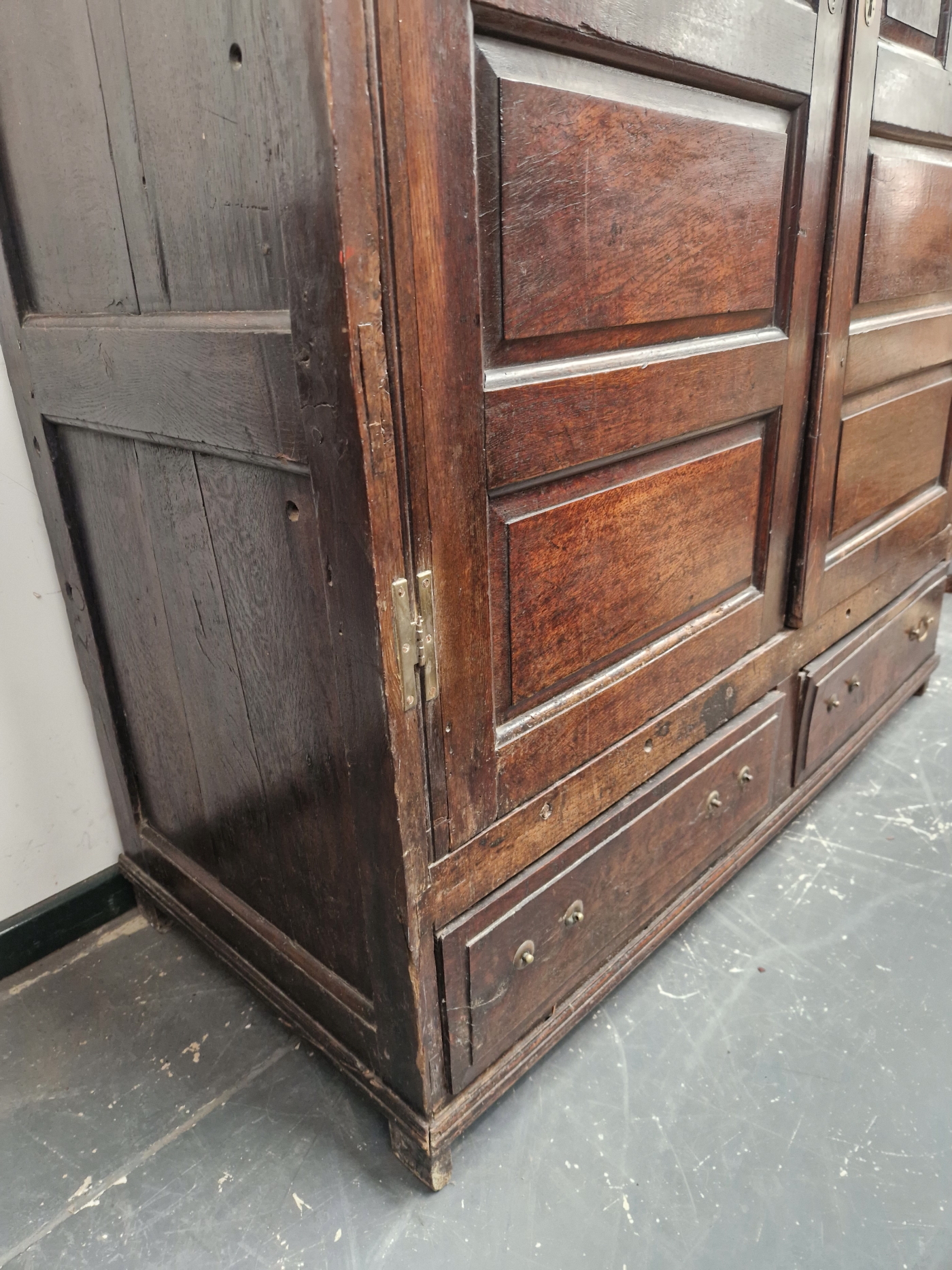 A 18th C. OAK CUPBOARD WITH PANELLED DOORS ENCLOSING HANGING SPACE OVER TWO SHORT DRAWERS. W 141 x D - Image 3 of 5