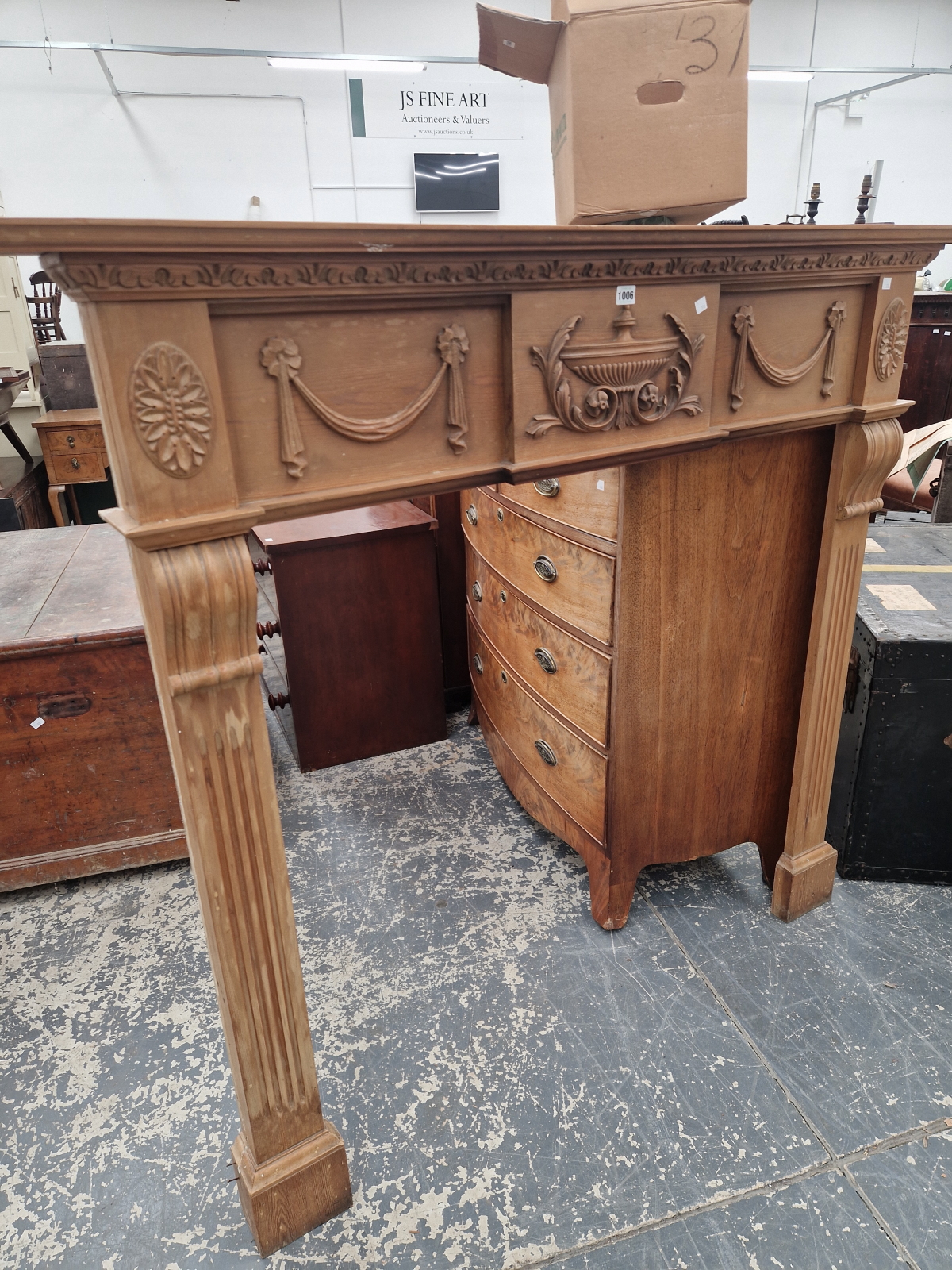 A REGENCY STYLE PINED FIRE SURROUND, THE FLUTED PILASTER SIDES CRESTED BY A CENTRAL URN FLANKED BY - Image 2 of 6