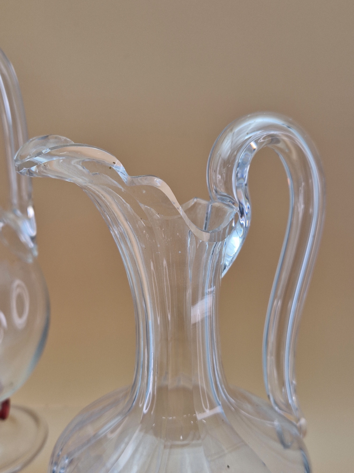 TWO LATE VICTORIAN BALUSTER GLASS EWERS, BOTHER WITH HOLLOW HANDLES, ONE ENGRAVED WITH TRAILING - Image 5 of 8