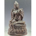 A BRONZE FIGURE IN DHYANASANA, POSSIBLY LORD VISHNU, SEATED WITH HIS RIGHT FOOT RESTING ON THE