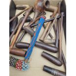 A COLLECTION OF ETHNIC WOODEN PIPES TO INCLUDE ONE MOUNTED WITH BEAD WORK AND ANOTHER WITH COPPER