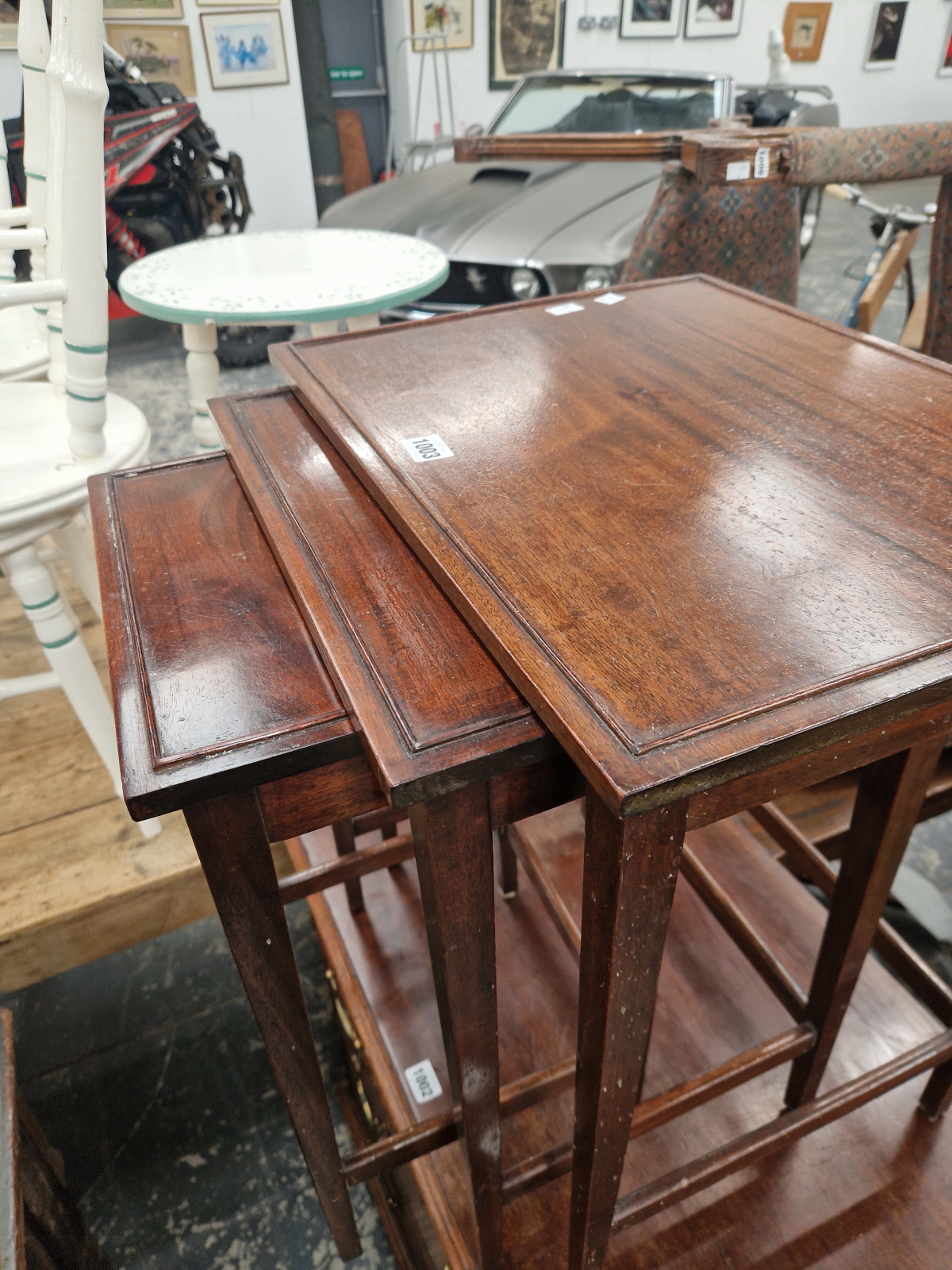 A NEST OF THREE CONTEMPORARY MAHOGANY COFFEE TABLES, EACH WITH RECTANGULAR TOPS. - Image 3 of 3