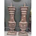 A PAIR OF IRON FLATTENED BALUSTER TABLE LAMPS SUPPORTED ON RECTANGULAR FEET. H 90cms.