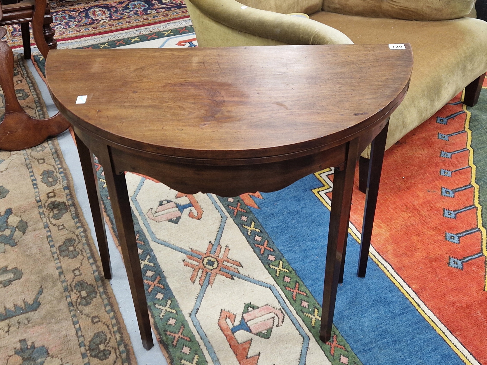 A MAHOGANY D-SHAPED GAMES TABLE OPENING ON ONE OF THE TAPERING SQUARE LEGS. W 75 x D 37 CLOSED x H