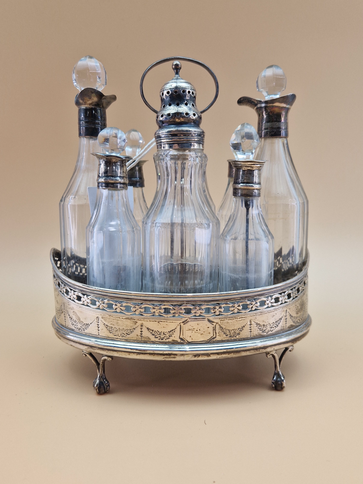 A SILVER CRUET STAND AND EIGHT BOTTLES WITH SILVER MOUNTS, LARGELY LONDON 1813 BUT ONE LONDON 1801