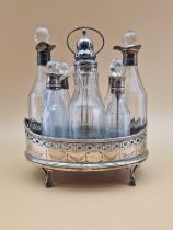 A SILVER CRUET STAND AND EIGHT BOTTLES WITH SILVER MOUNTS, LARGELY LONDON 1813 BUT ONE LONDON 1801