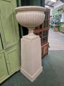 A LARGE TERRACE URN ON PEDESTAL STAND