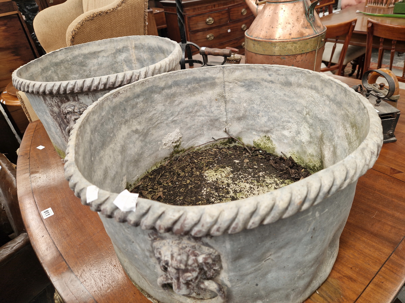 A PAIR OF 19th C. LEAD CYLINDRICAL PLANTERS WITH GADROONED RIMS ABOVE FOUR LION MASK AND RING - Image 2 of 4