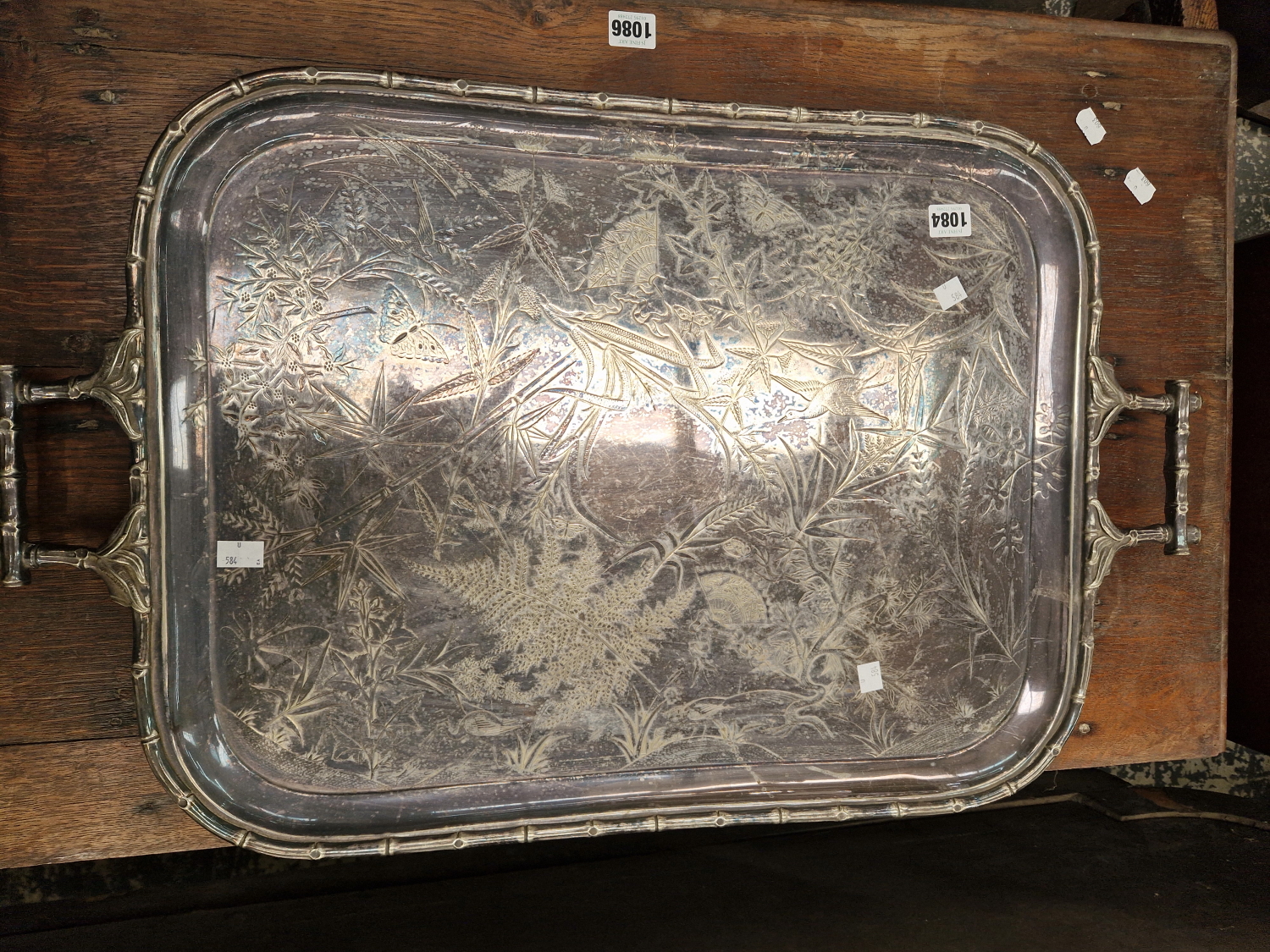 A LARGE SILVER PLATED TRAY IN THE AESTHETIC TASTE.