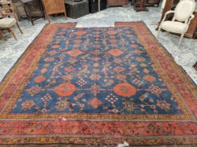 AN ANTIQUE TURKISH OUSHAK CARPET. 390 x 320 cm (LOSSES)