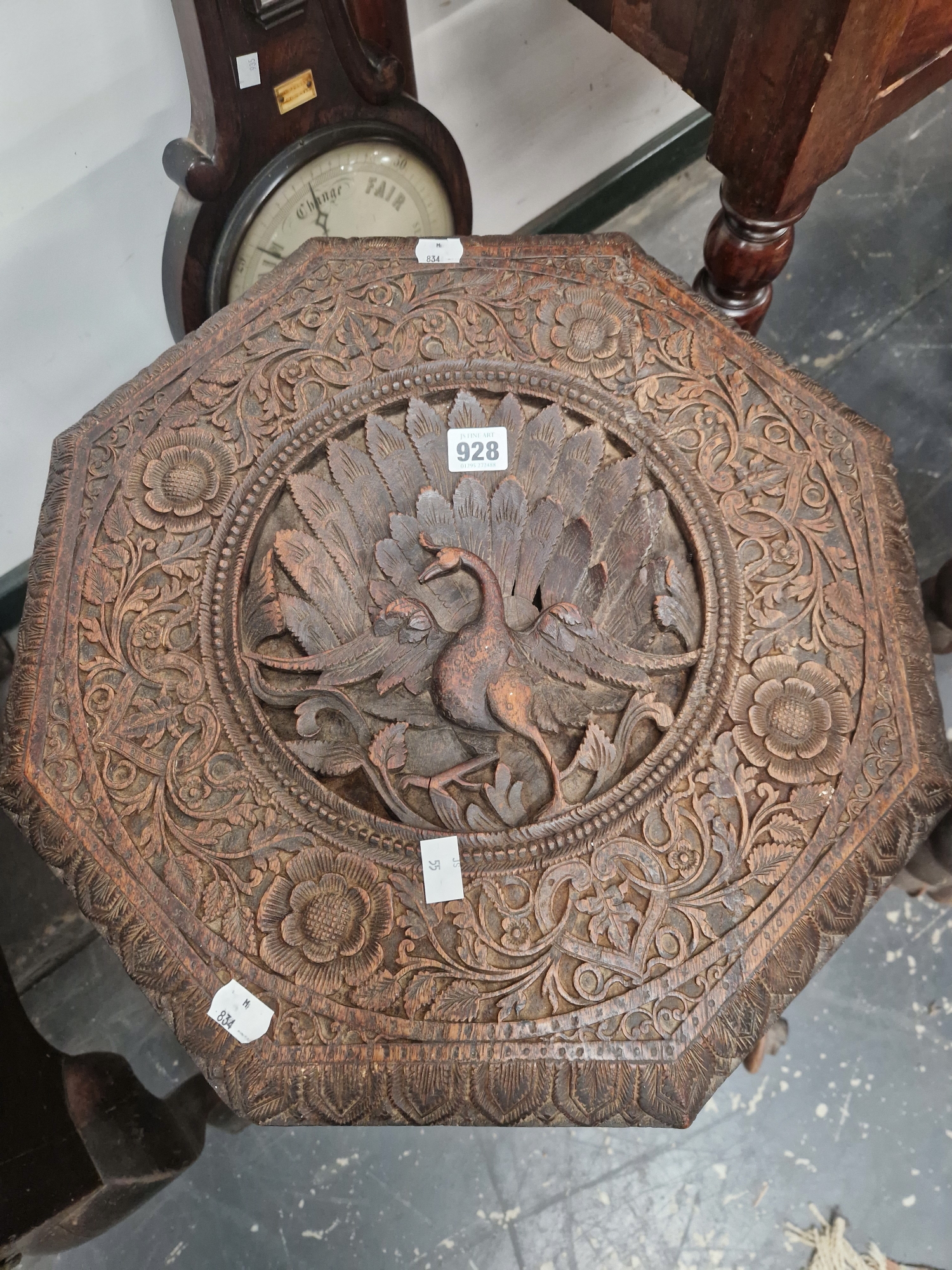 AN ISLAMIC OCTAGONAL TABLE, THE TOP PIERCED AND CARVED WITH A PEACOCK ROUNDEL, THE THREE BUTTRESS - Image 2 of 2