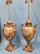 A PAIR OF ORMOLU MOUNTED MOTTLED PINK MARBLE TWO HANDLED BALUSTER LAMPS, EACH WITH TWO SOCKETS AND