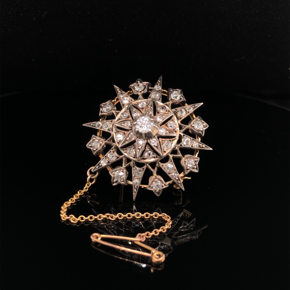 AN ANTIQUE OLD CUT DIAMOND RADIATING STAR BROOCH WITH ATTACHED SAFETY CHAIN. THE PRINCIPLE OLD CUT - Image 5 of 5